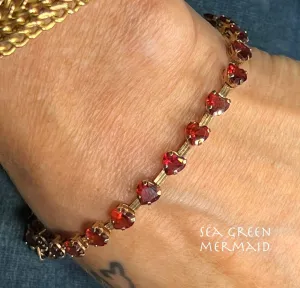 10k Yellow Gold Red Garnet Hearts Bracelet. Safety Clasp