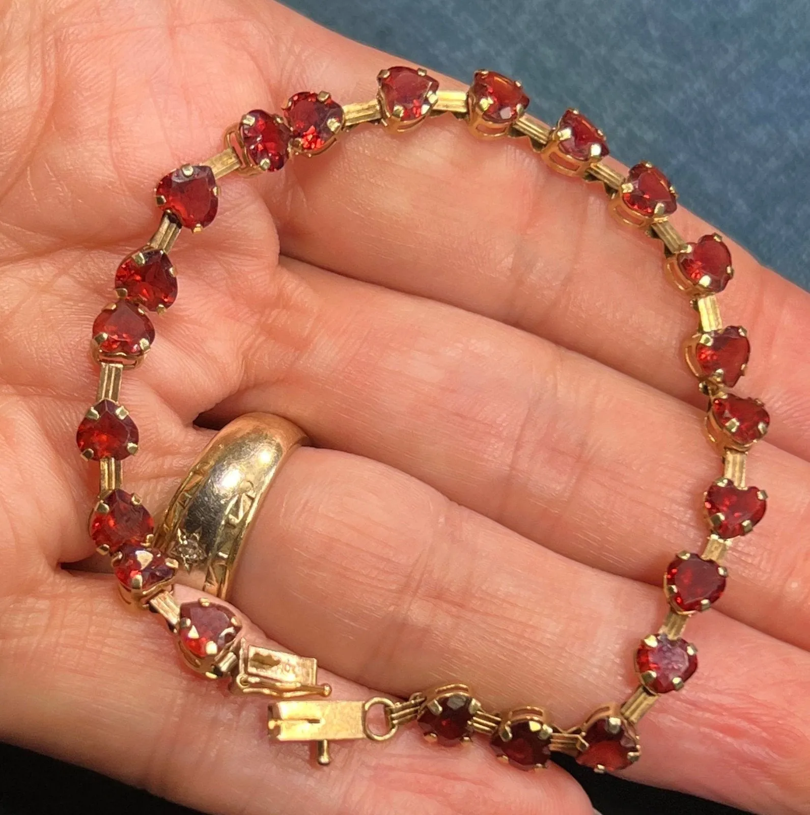 10k Yellow Gold Red Garnet Hearts Bracelet. Safety Clasp