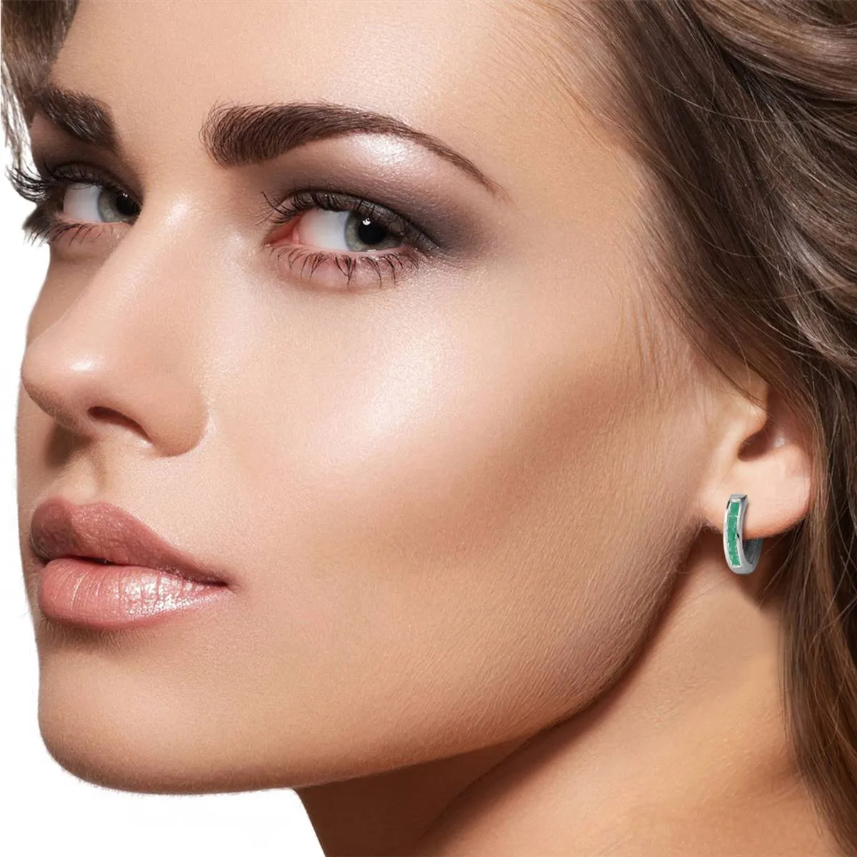 14K. SOLID WHITE GOLD OVAL HUGGIE EARRING WITH EMERALDS