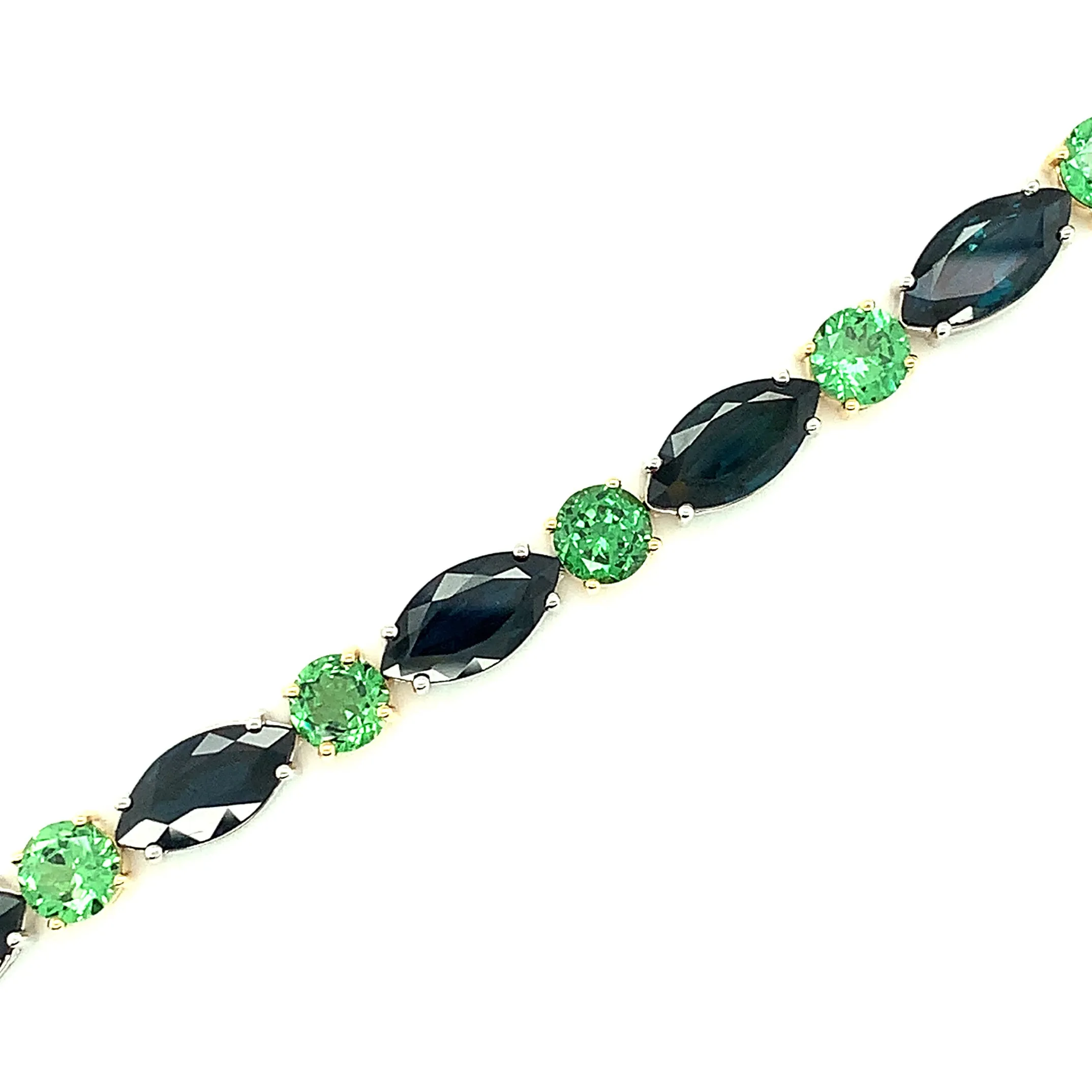 Blue Sapphire and Tsavorite Garnet Tennis Bracelet in White and Yellow Gold