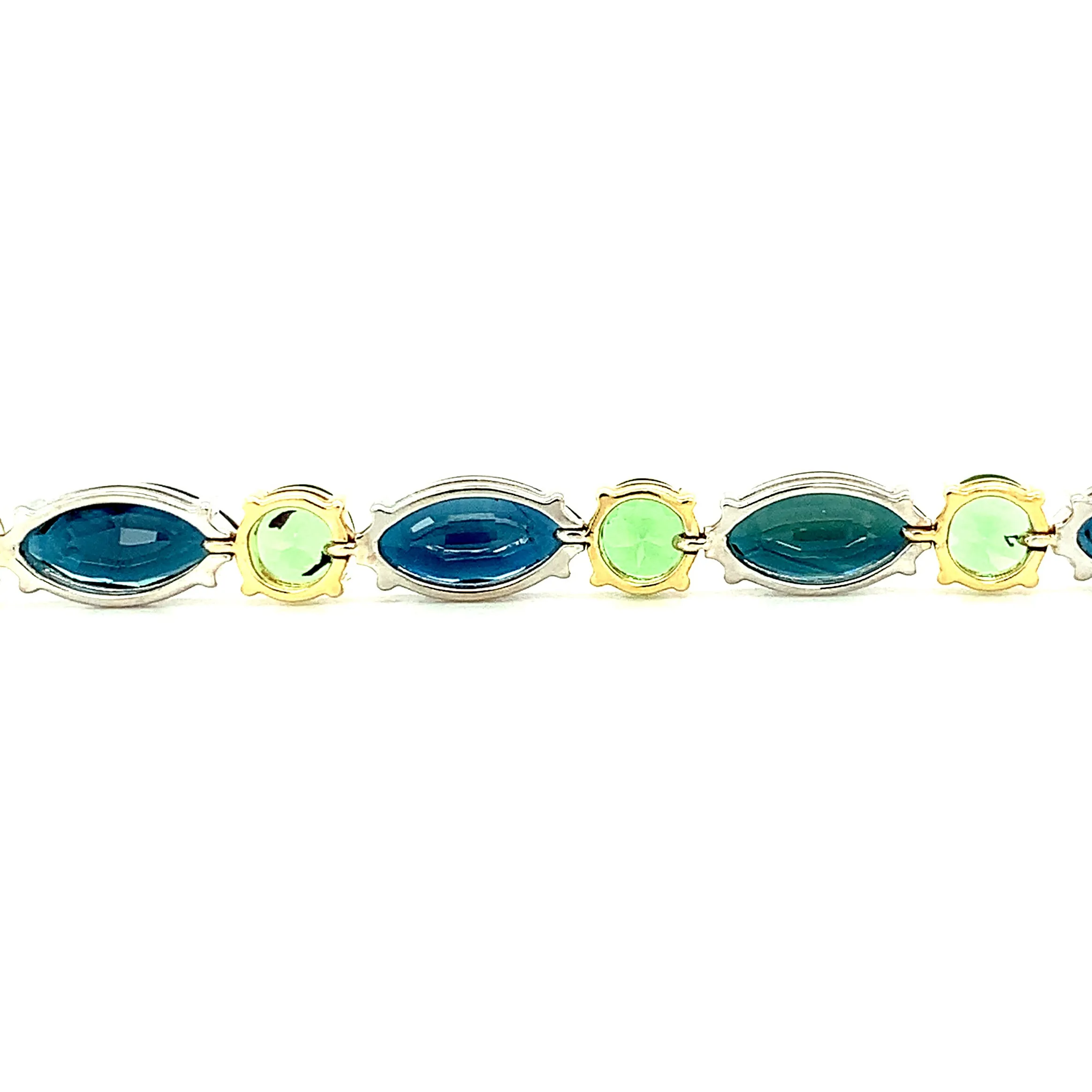 Blue Sapphire and Tsavorite Garnet Tennis Bracelet in White and Yellow Gold