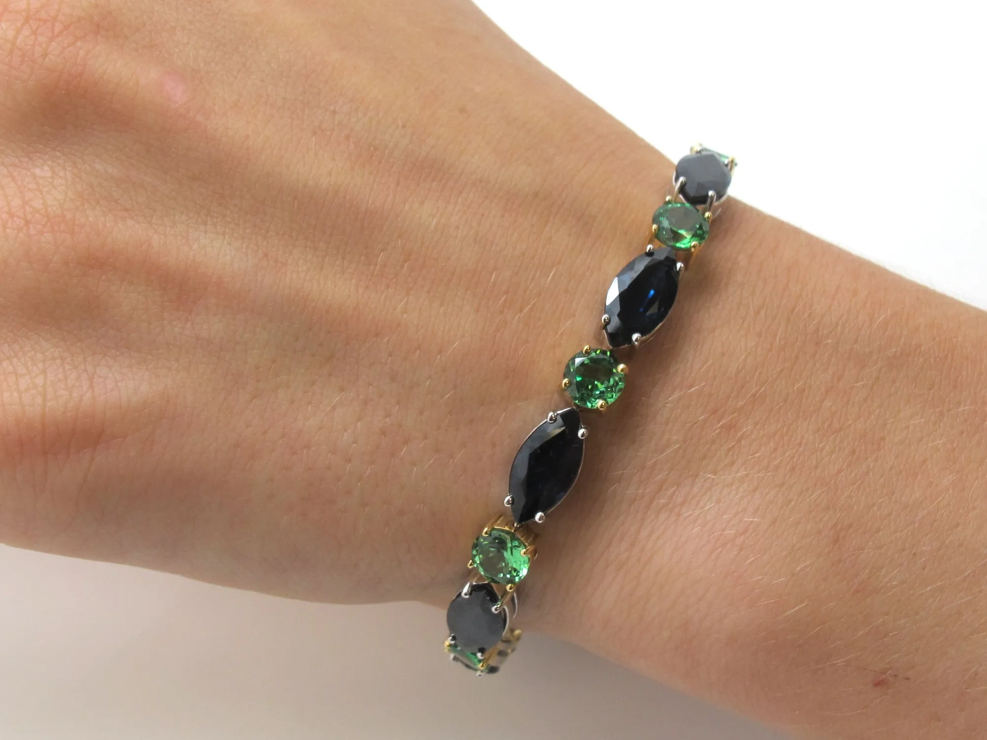 Blue Sapphire and Tsavorite Garnet Tennis Bracelet in White and Yellow Gold
