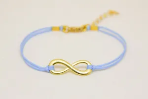 Gold infinity bracelet, womens bracelet with a blue cords, adjustable