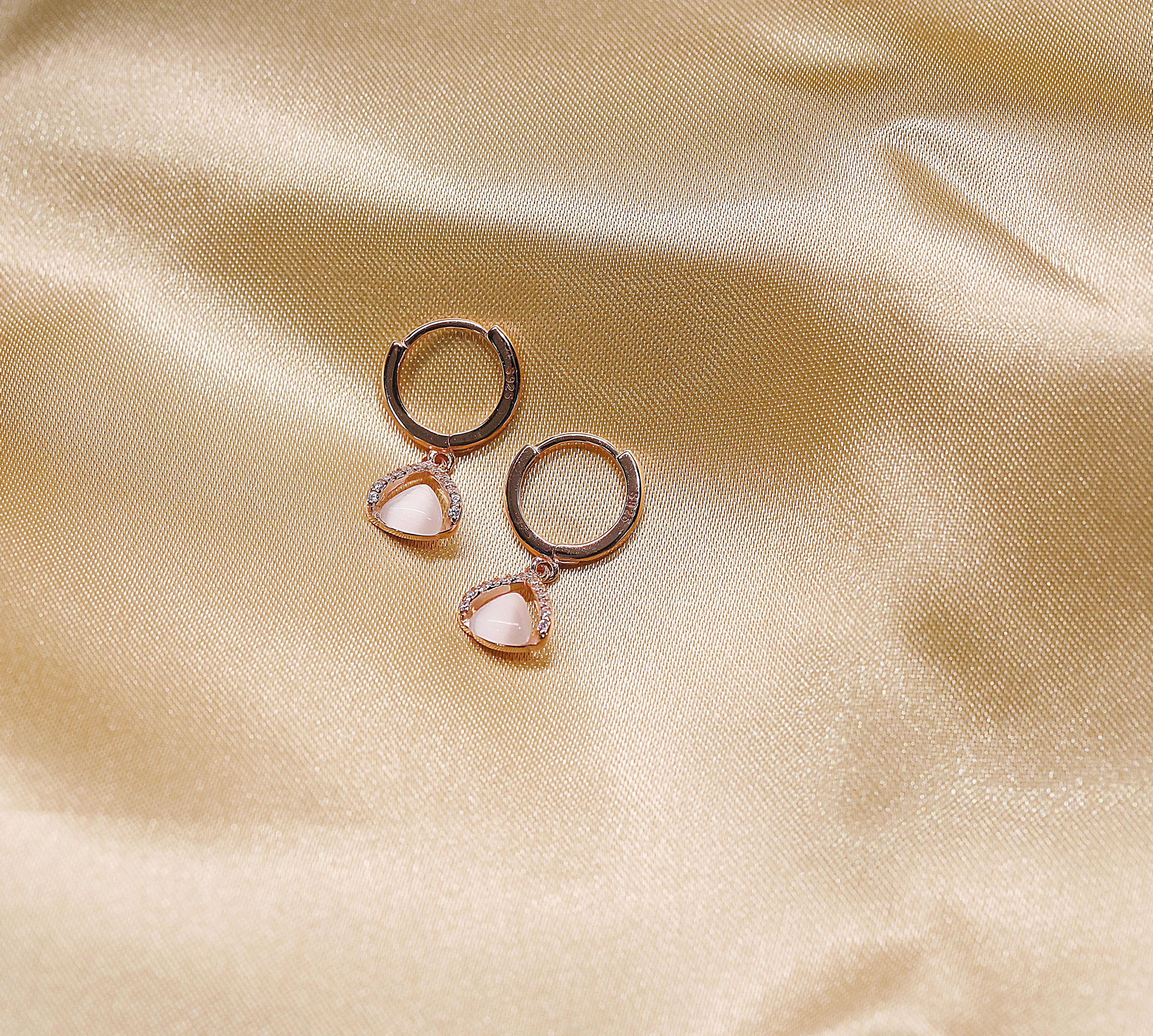 Tiny triangular rose gold hoop earrings